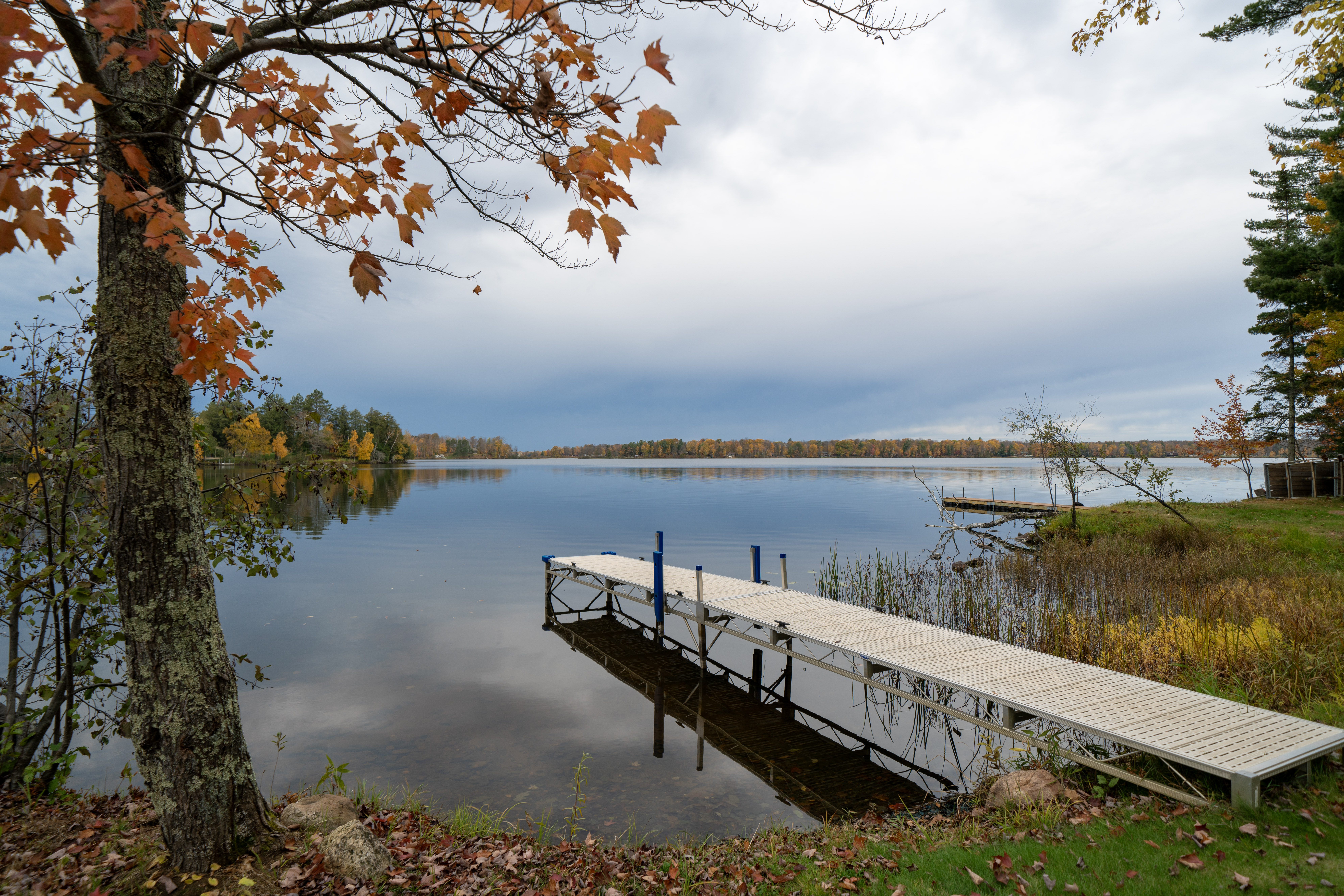 _DSC0553 Water view from Telemark Northwoods Lodging in Cable, Wisconsin, with late‑autumn foliage and golden light.